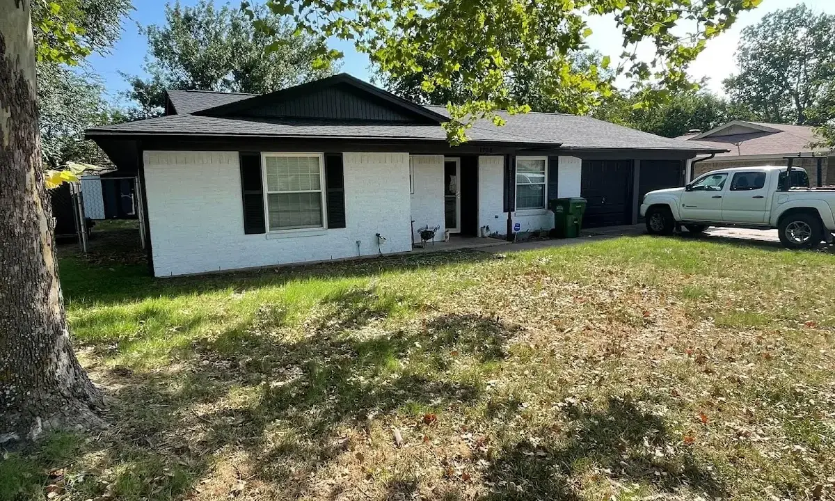 Professional roofing crew working on a residential roof in South Londonderry